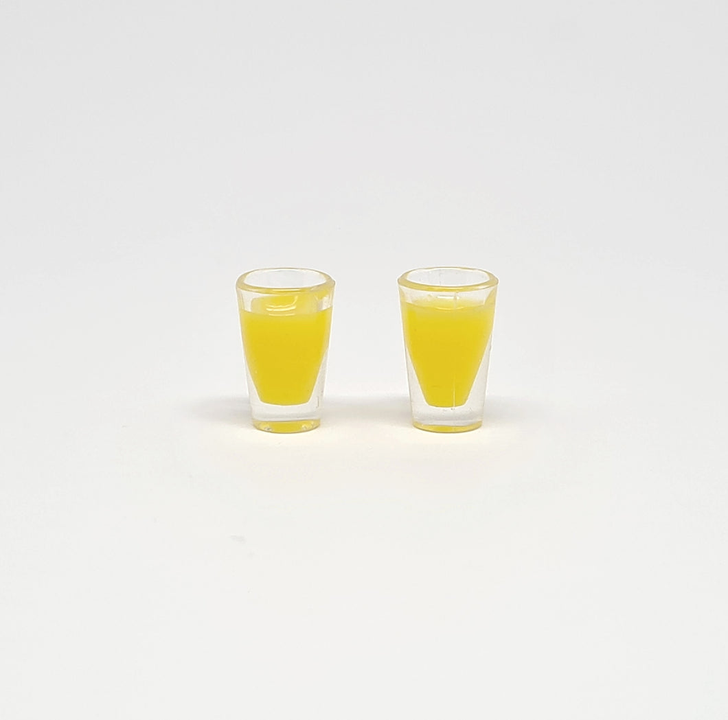 Two Miniature Glasses of Orange Juice